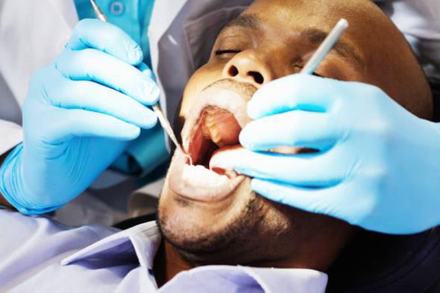 A patient being examined by a dentist