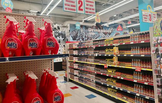 The interactive experience starts in a supermarket with aisles full of fake products like sauces, cereal, medicine, and canned soup.