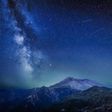 The Delta Aquariids meteor shower and Milky Way over Mount St. Helens, at Windy Ridge in Washington State with Mt. Hood, Oregon visible in the lower left corner. In 2023, it's occurring at the same time as the Alpha Capricornids shower.Diana Robinson P...
