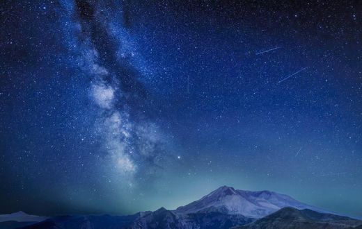 The Delta Aquariids meteor shower and Milky Way over Mount St. Helens, at Windy Ridge in Washington State with Mt. Hood, Oregon visible in the lower left corner. In 2023, it's occurring at the same time as the Alpha Capricornids shower.Diana Robinson P...