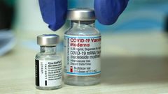Vials of the Moderna and Pfizer COVID vaccines are seen above in Israel.