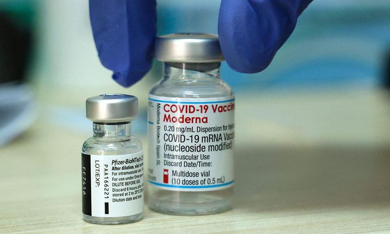 Vials of the Moderna and Pfizer COVID vaccines are seen above in Israel.