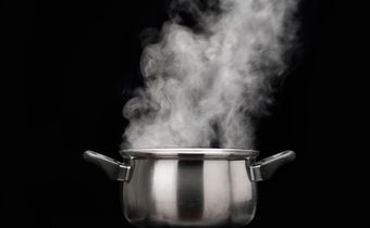 steam over cooking pot