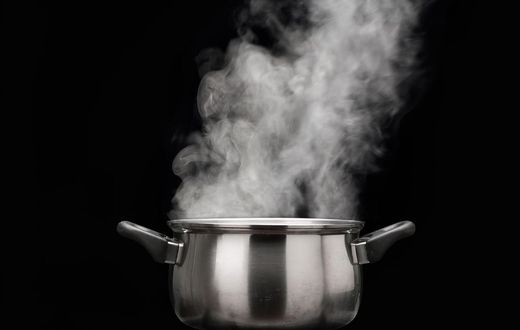 steam over cooking pot