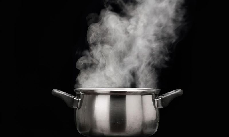 steam over cooking pot