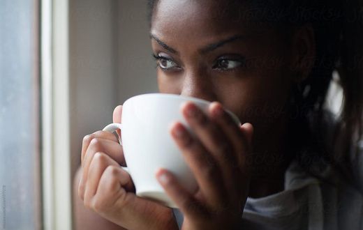 Black woman drinking tea [Stocksy]