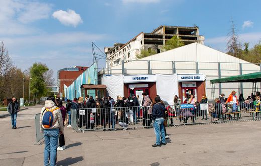 Refugees wait to apply for a cash assistance program in Chisinau, one of eight registration sites across Moldova.