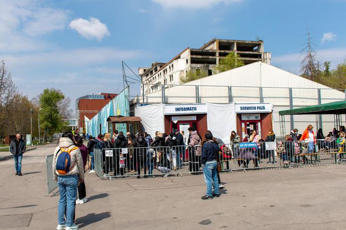 Refugees wait to apply for a cash assistance program in Chisinau, one of eight registration sites across Moldova.