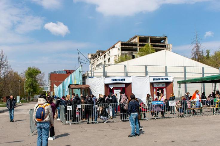 Refugees wait to apply for a cash assistance program in Chisinau, one of eight registration sites across Moldova.