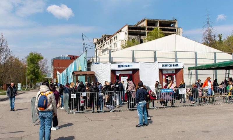 Refugees wait to apply for a cash assistance program in Chisinau, one of eight registration sites across Moldova.