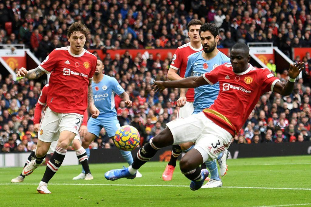 Manchester United centre-back Eric Bailly (R) concedes an own-goal against Manchester City at Old Trafford.