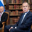 Russian Foreign Minister Sergei Lavrov looks on, next to Russian President Vladimir Putin, as they wait for the US-Russia summit at the Villa La Grange, in Geneva on June 16, 2021.
