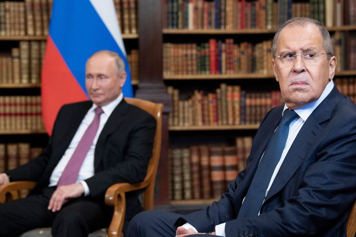 Russian Foreign Minister Sergei Lavrov looks on, next to Russian President Vladimir Putin, as they wait for the US-Russia summit at the Villa La Grange, in Geneva on June 16, 2021.