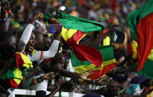 Senegal supporters at the Olembe Stadium celebrate their team's victory