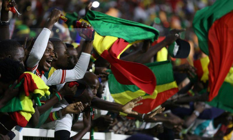 Senegal supporters at the Olembe Stadium celebrate their team's victory