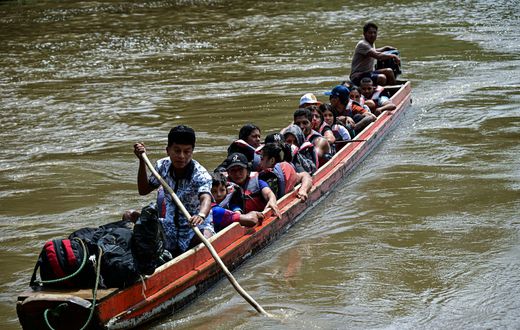 Migrants arrive at the Reception Center for Migrant Care in Lajas Blancas, in the jungle province of Darien, Panama, on June 28, 2024.MARTIN BERNETTI/AFP via Getty Images