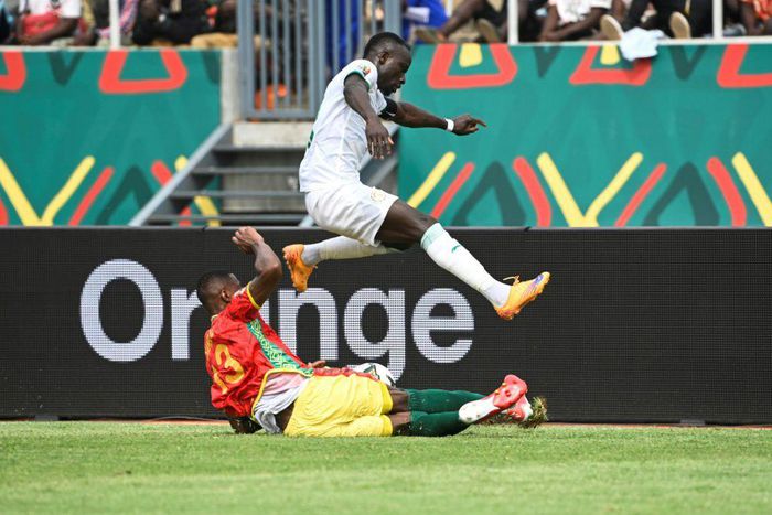 Senegal captain and forward Sadio Mane (R) evades a tackle by Guinea defender Issiaga Sylla during an Africa Cup of Nations Group B match in Bafoussam on Friday.
