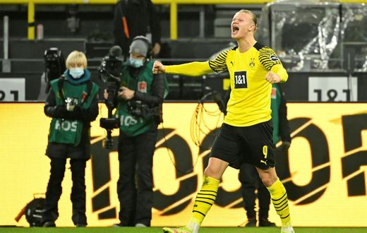 Erling Haaland celebrates scoring his second goal for Dortmund on Friday