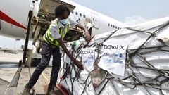 Workers unload a shipment of Covid-19 vaccines secured through COVAX in the Ivory Coast in February 2021.