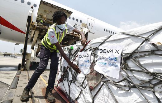 Workers unload a shipment of Covid-19 vaccines secured through COVAX in the Ivory Coast in February 2021.