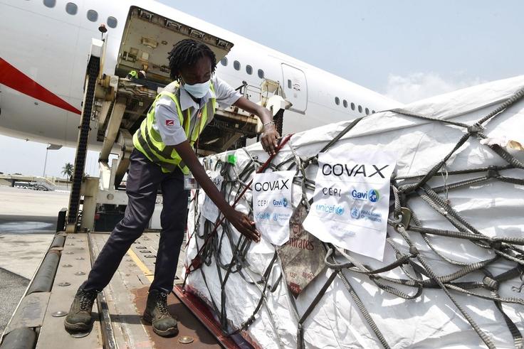 Workers unload a shipment of Covid-19 vaccines secured through COVAX in the Ivory Coast in February 2021.