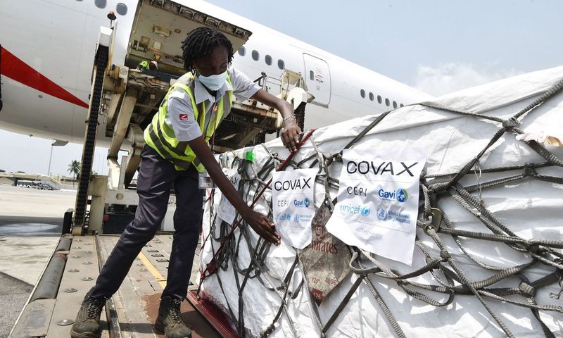 Workers unload a shipment of Covid-19 vaccines secured through COVAX in the Ivory Coast in February 2021.