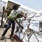 Workers unload a shipment of Covid-19 vaccines secured through COVAX in the Ivory Coast in February 2021.