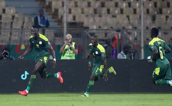 Famara Diedhiou celebrates wildly after scoring the opener against Equatorial Guinea.