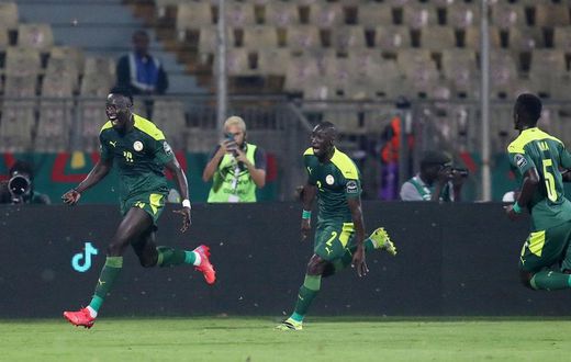 Famara Diedhiou celebrates wildly after scoring the opener against Equatorial Guinea.
