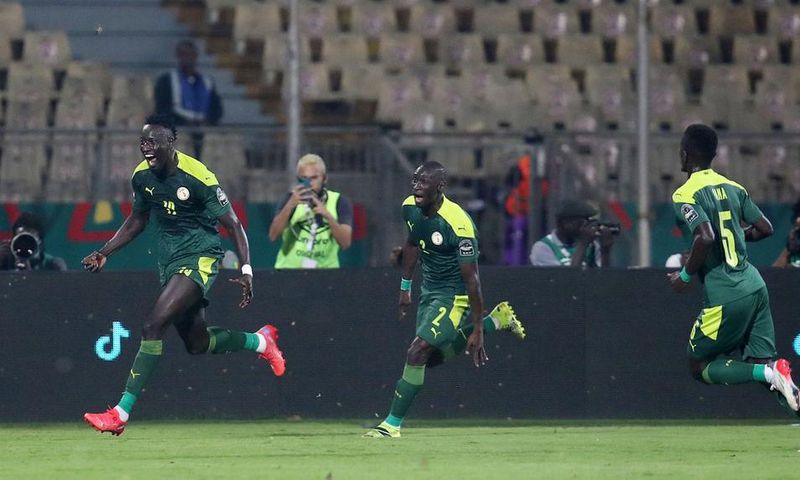 Famara Diedhiou celebrates wildly after scoring the opener against Equatorial Guinea.
