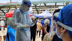 People queue for Covid-19 tests in Shanghai, China.