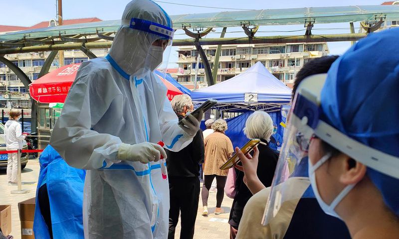 People queue for Covid-19 tests in Shanghai, China.