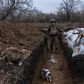 Ukrainian soldiers builds a bunker on the front line on.