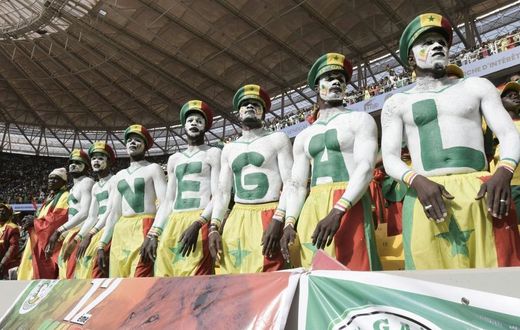 Senegal supporters are seen during the World Cup 2022 qualifying football match between Senegal and Egypt at the Me Abdoulaye Wade Stadium in Diamniadio on March 29, 2022. (Photo by SEYLLOU / AFP) (Photo by SEYLLOU/AFP via Getty Images)