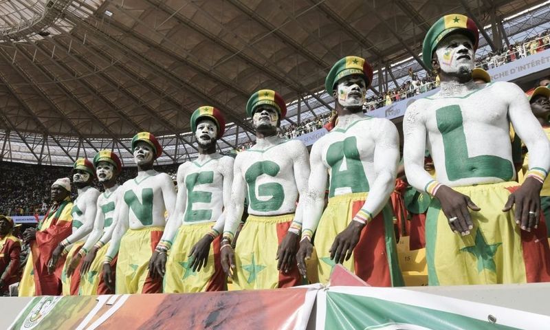 Senegal supporters are seen during the World Cup 2022 qualifying football match between Senegal and Egypt at the Me Abdoulaye Wade Stadium in Diamniadio on March 29, 2022. (Photo by SEYLLOU / AFP) (Photo by SEYLLOU/AFP via Getty Images)