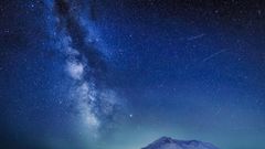 The Delta Aquariids meteor shower and Milky Way over Mount St. Helens, at Windy Ridge in Washington State with Mt. Hood, Oregon visible in the lower left corner. In 2023, it's occurring at the same time as the Alpha Capricornids shower.Diana Robinson P...