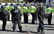 1444x920 police-officers-stand-guard-as-they-face-protesters-throwing-bricks-and-beverage-cans-outside-the-liver-building-in-liverpool-on-august-3-2024-during-the-enough-is-enough-demonstration-held-in-reacti