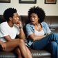 An AI-generated photo of a black couple arguing. They're sitting on a couch