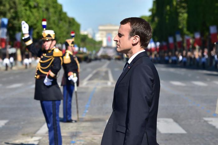 French President Emmanuel Macron stands at attention during the Bastille Day parade in Paris, July 14, 2017.