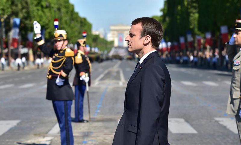 French President Emmanuel Macron stands at attention during the Bastille Day parade in Paris, July 14, 2017.