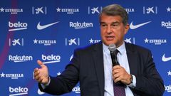 Joan Laporta said Barcelona were working to persuade Lionel Messi to stay as the club introduced Eric Garcia