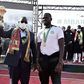 Senegal President Macky Sall holds the Africa Cup of Nations trophy flanked by coach Cisse and skipper  Kalidou Koubaly