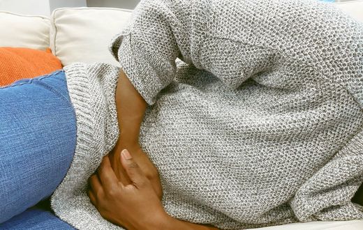 Abdominal pain is a common symptom of colon cancer.Getty Images