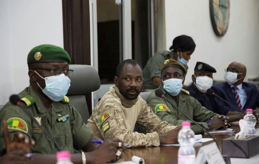 Colonel Assimi Goita, centre, has been granted presidential-like powers as head of the new junta, according to a document posted on Mali's official gazette