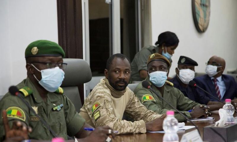 Colonel Assimi Goita, centre, has been granted presidential-like powers as head of the new junta, according to a document posted on Mali's official gazette