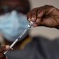 In this Wednesday, July 28, 2021 file photo, a health worker administers a dose of Janssen COVID-19 vaccine by Johnson & Johnson in the Medina neighborhood in Dakar, Senegal.