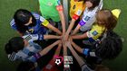 football-unites-the-world-girls-with-armbands