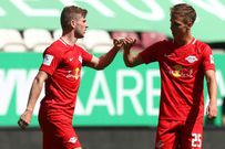 Timo Werner, 24, is congratulated by former RB Leipzig teammate Dani Olmo, 22, during a Bundesliga game against Augsburg in June.