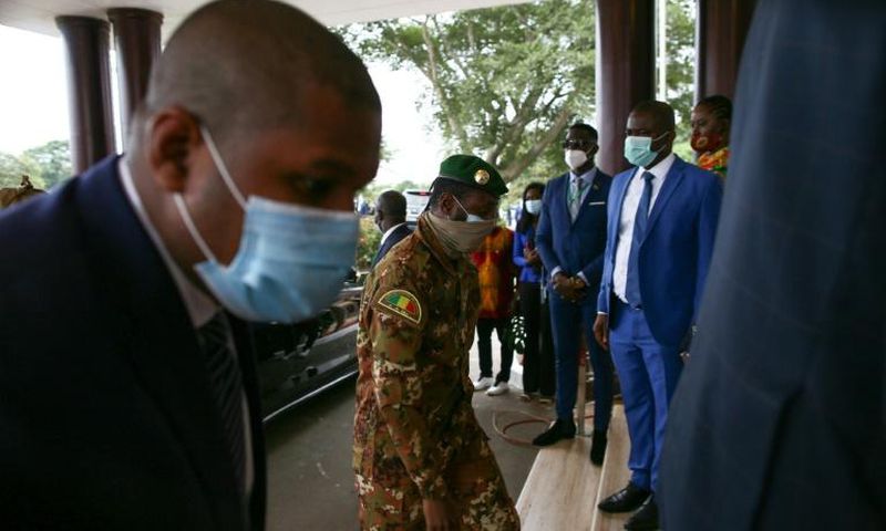 The head of the Malian military junta, Col. Assimi Goita, centre, arriving in Ghana for the ECOWAS summit