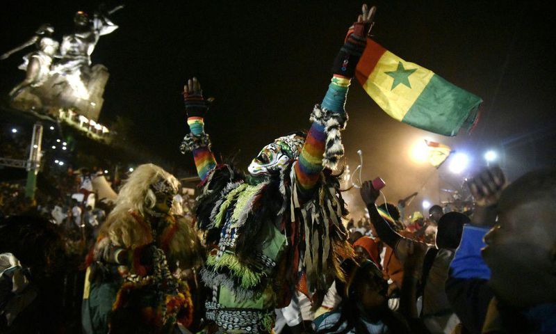 Senegal supporters celebrate in Dakar after the Lions beat Egypt in the Africa Cup of Nations final
